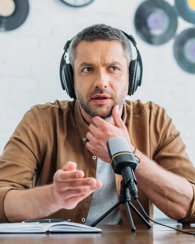 thoughtful-radio-host-in-headphones-recording-podcast-in-broadcasting-studio-e1664708812456.jpg thoughtful-radio-host-in-headphones-recording-podcast-in-broadcasting-studio-e1664708812456.jpg